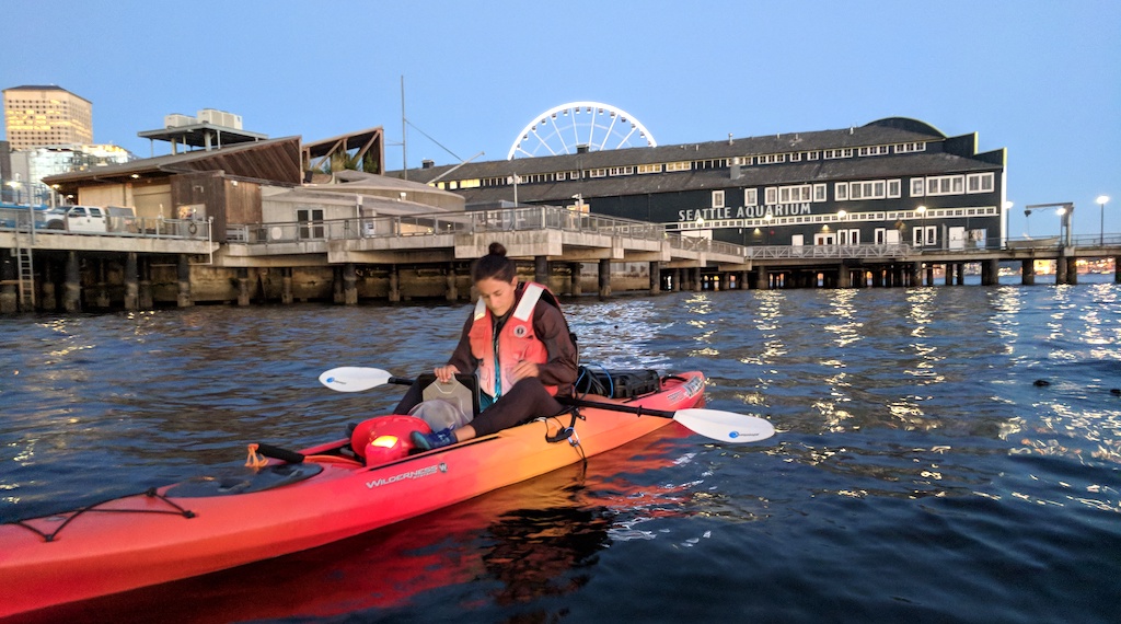 UW graduate student Kerry Accola uses high-frequency sonar equipment mounted on the bottom of a kayak to observed the behavior of young salmon. Photo: UW