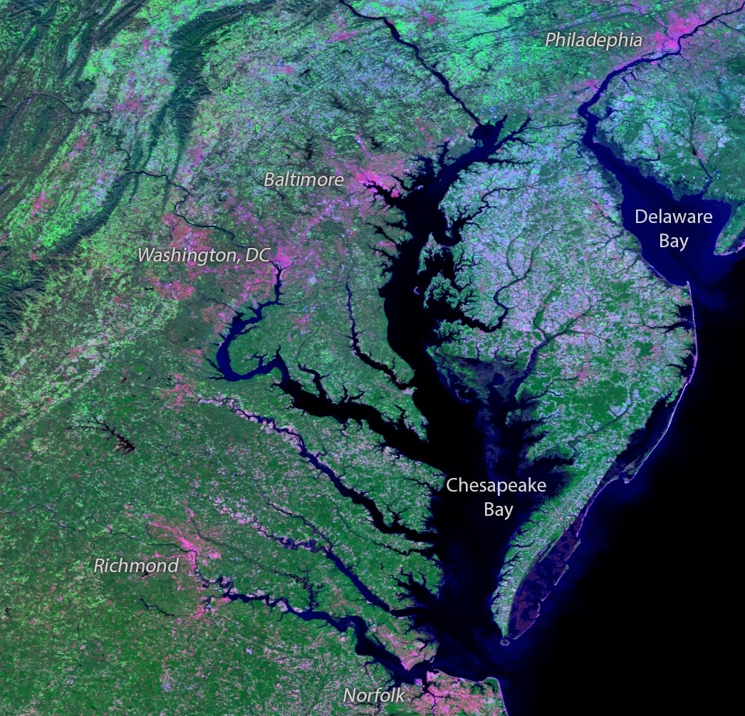 Satellite view of the Chesapeake Bay region with labeled cities including Philadelphia, Baltimore, Washington D.C., Richmond, and Norfolk.