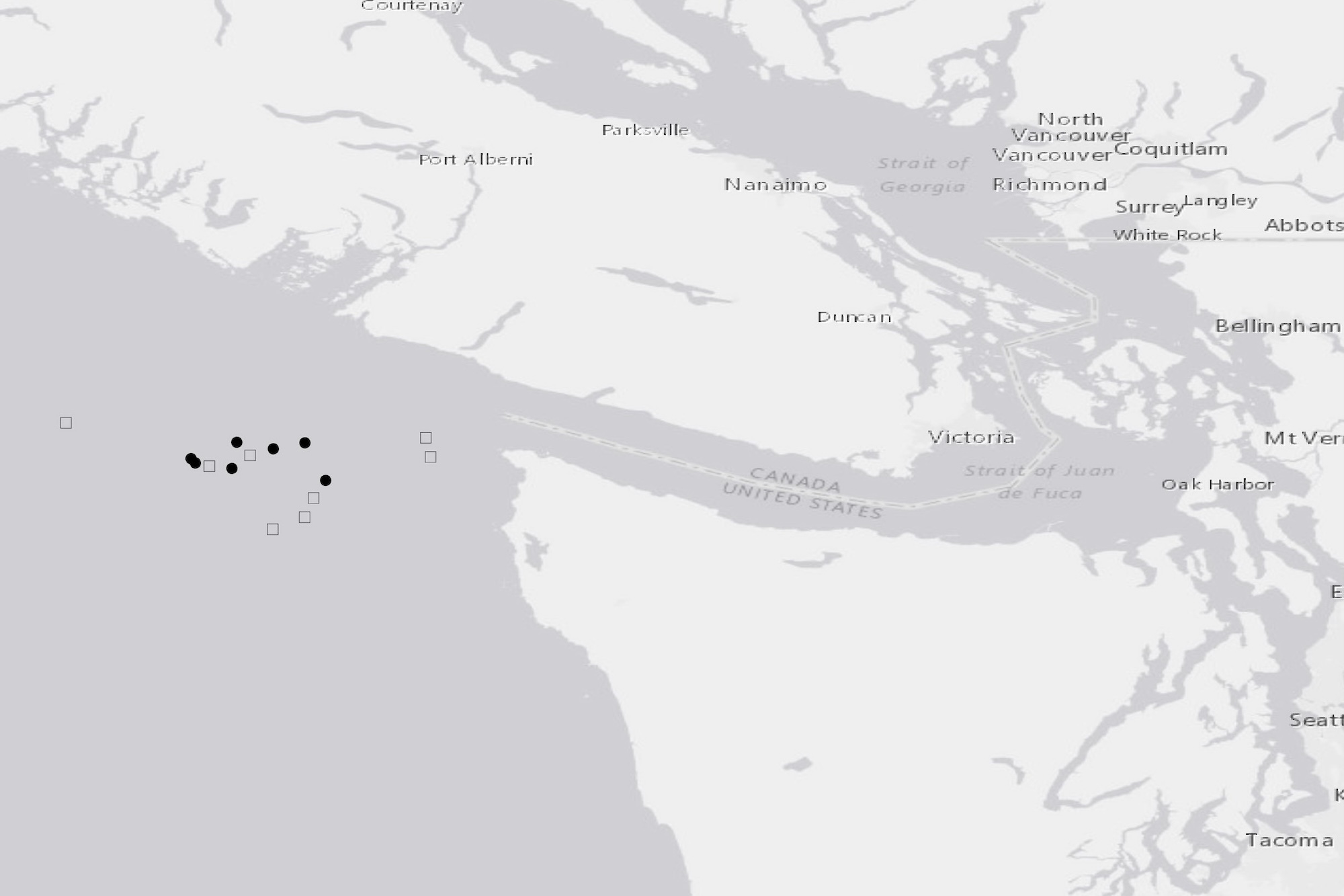 Map showing sightings of two humpback whales circles and squares in waters around Vancouver Island and Puget Sound.