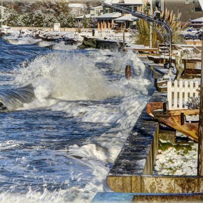 Storm surges against the bulkheads protecting beach houses at Mutiny Bay, WA. Photo: Scott Smithson (CC BY-NC-ND 2.0) https://www.flickr.com/photos/dtwpuck/15725058917