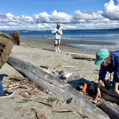 Sheryl and Todd Ramsey with Gretchen Waymen-Palmer in the wood zone of Point No Point beach. Photo: Eric Wagner