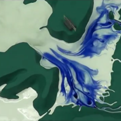 Blue dye is used to illustrate currents in the Puget Sound Model at the UW School of Oceanography. Video screenshot: copyright Richard Strickland and Encyclopedia of Puget Sound