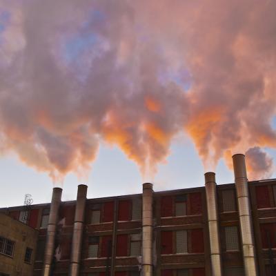 Smokestacks in sunlight. Photo: Joe Brusky (CC BY-NC 2.0 https://creativecommons.org/licenses/by-nc/2.0/)