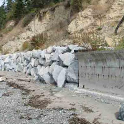 Former feeder bluff with sediment impounded by armoring. Photo by Hugh Shipman.