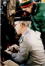 Don Malins examines a fish during a research trip to the Duwamish estuary. Photo circa 1987. Photographer unknown. 